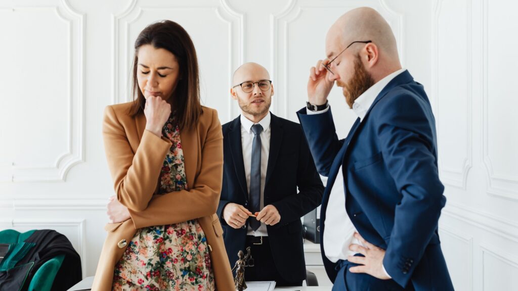 Couple consulting professionals about business valuation for divorce and financial settlement