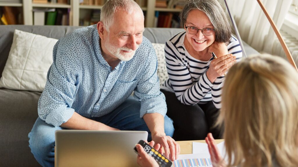 Couple meeting with a financial advisor to discuss retirement plans.